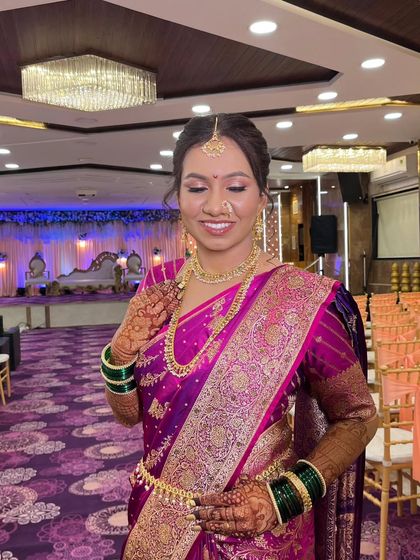 The bride looks serene and beautiful in the banquet hall. The makeup is designed to look great both in person and in photographs, under any lighting.