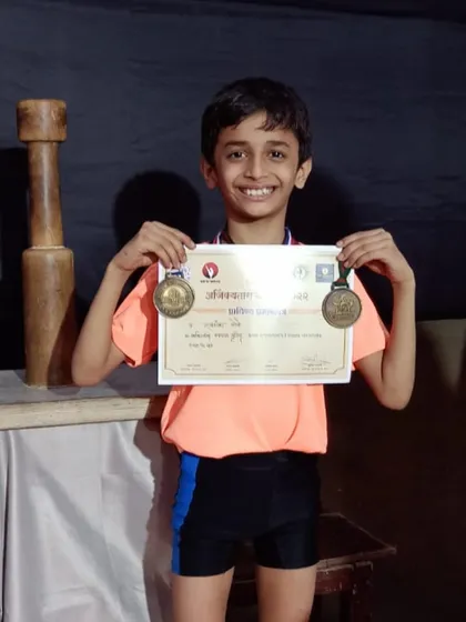 The proudest moments are seeing our students' hard work pay off. Here is our champion Swaransh More, smiling with his well-earned medals and certificate after winning 1st place at the State Selection Mallakhamb Competition.
