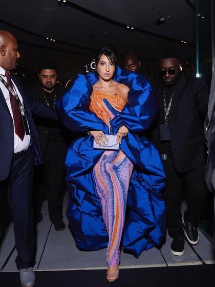 For Nora Fatehi's main IIFA 2023 appearance, we went for high drama with this structural Jean-Pierre Khoury gown. The voluminous royal blue wrap over a psychedelic-print catsuit was a bold fashion choice that truly owned the carpet.