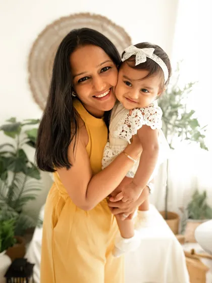 A sweet hug between a mother and her baby girl. Even with a toddler brother in the session, I make sure to capture these precious one-on-one moments.