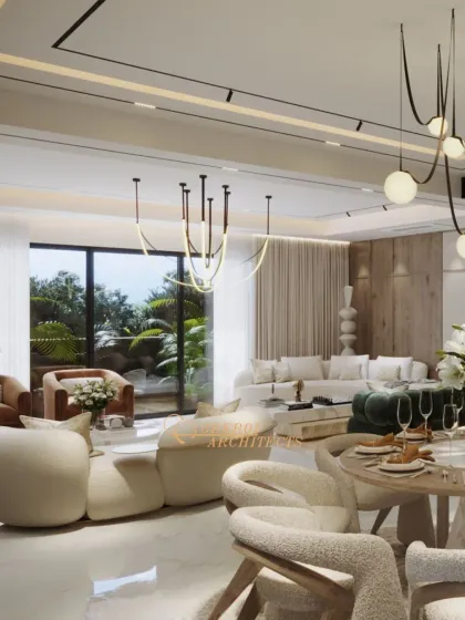 An open-plan living and dining area designed with soft, neutral tones and natural textures. The space feels warm and inviting, with comfortable seating and modern lighting.