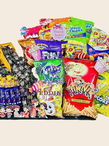 This Rakhi, gift an explosion of flavor with our "truckload of snacks" hamper. It features a toy truck spilling candies onto a tower of chocolates, surrounded by a mountain of chips.