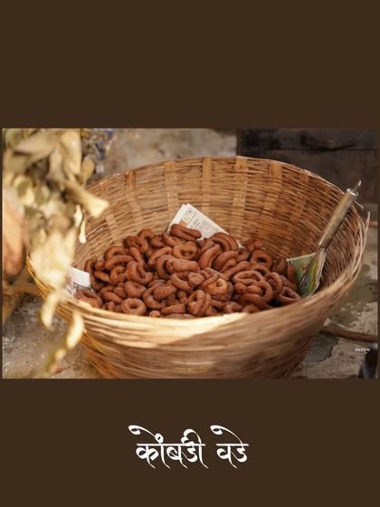 A detail shot of 'Kombdi Vade', a traditional delicacy often served at celebrations in Maharashtra. Capturing the food is part of telling the story of the event, as it's so central to our culture and gatherings.