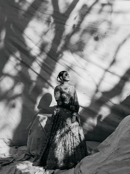 As architects, we are drawn to light and shadow. This black and white bridal portrait uses the stark contrast of shadows to create a fine art piece, highlighting the bride's elegance and the quiet emotion of the moment. It’s where documentary meets magazine style.