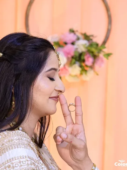 A creative and playful shot of the bride showing off her engagement ring.