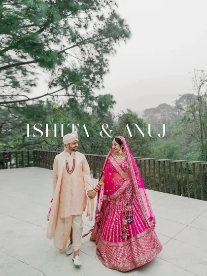 A beautiful portrait of the couple walking hand-in-hand, with the misty, green hills providing a serene destination wedding backdrop.