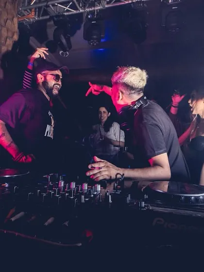 A great action shot of me and Ankytrixx pointing to the crowd, fully engaged in the performance.
