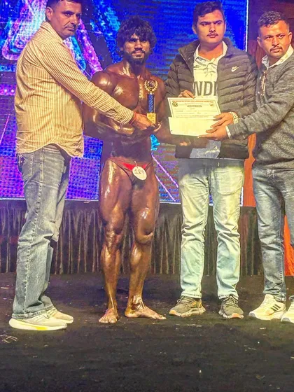 Receiving my trophy and certificate for 2nd place at Mr. Haryana. A proud moment, but also motivation to come back even better next time.