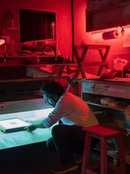 The heart of my practice is the darkroom. Under the soft red glow of the safelight, I hand-develop each print, watching the image slowly appear. This is where the real alchemy of analog photography happens.