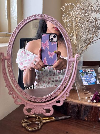 Close-up of the hand-painted phone case insert. You can see the little details and sparkles that make it unique.