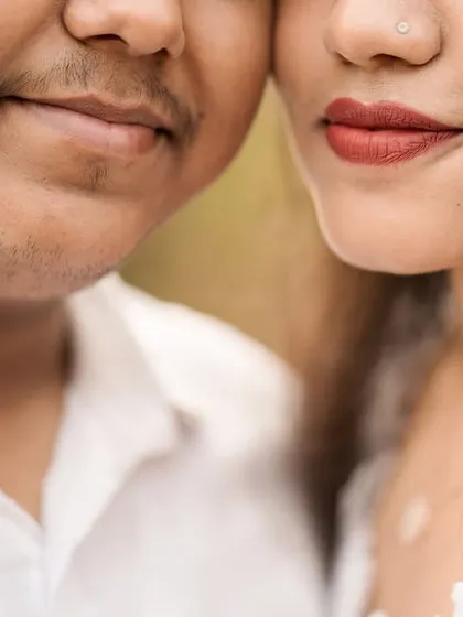 An extreme close-up that focuses on the subtle details of intimacy. This frame captures a quiet, unspoken connection, highlighting the tenderness in their relationship.