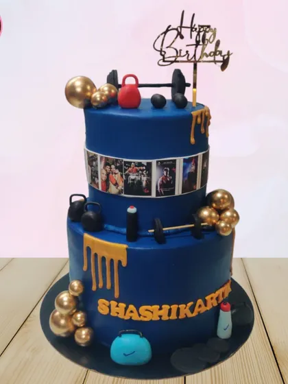 This two-tiered gym-themed cake is for the fitness enthusiast in your life. It's decorated with detailed, edible gym equipment like dumbbells and kettlebells, and even features a photo reel of personal fitness milestones.