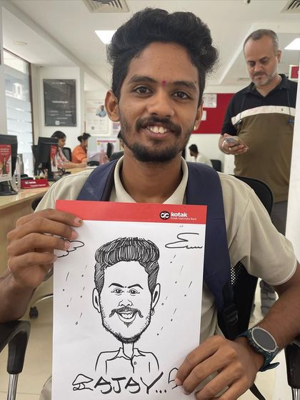 A live caricature session for the staff and customers at a Kotak Mahindra Bank branch in Dombivali. It's a great way to foster community and fun in a professional environment.