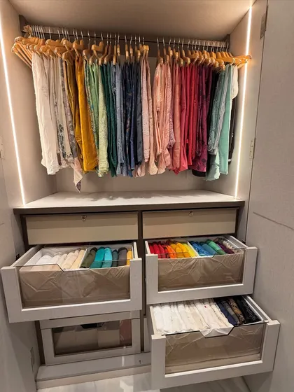 A beautiful example of color-coded vertical folding in deep drawers. This not only looks satisfying but also makes coordinating outfits incredibly simple.