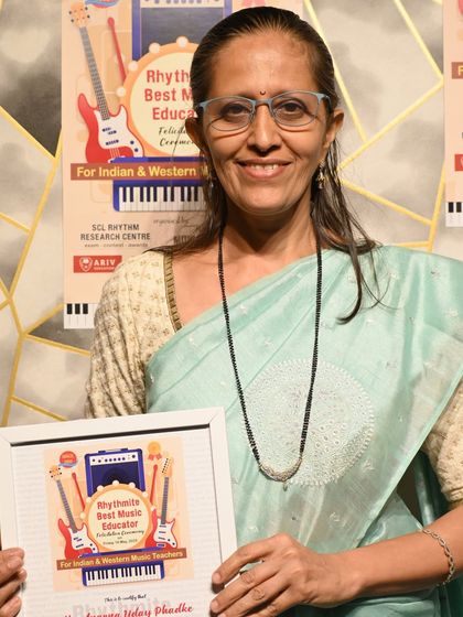 Ms. Aparna Uday Phadke receives her Rhythmite Best Music Educator Award. We are honored to have such a talented faculty.