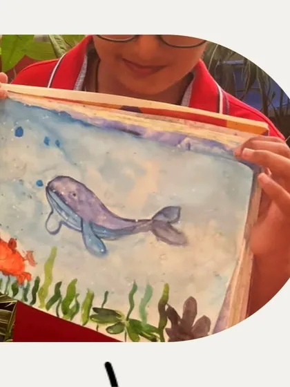 This beautiful watercolor ocean scene was created by one of our middle school students. We focused on watercolor techniques to create the soft, blended look of the water and marine life.