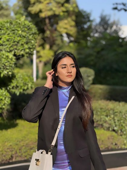 Posing outdoors, the holographic dress looks amazing in the sunlight.