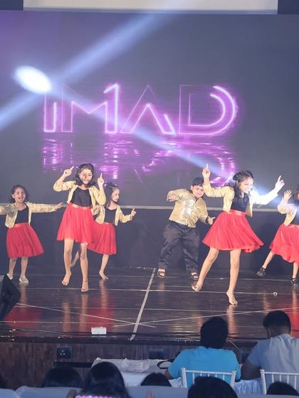 Our kids' batch brings the fun with their "Dance ka Bhoot" performance, dressed in stylish red and gold outfits.