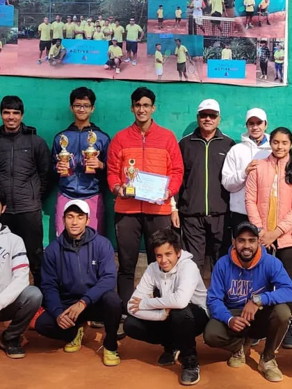 The entire team celebrates the success of our players, including a runner-up finish in a Men's doubles tournament in Jalandhar.