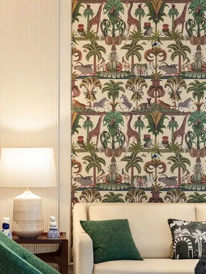 In interior design, details define the space. The intricate, jungle-themed wallpaper panel becomes a piece of art in itself, adding a layer of whimsy and sophistication to this living room.