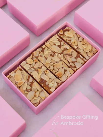 Our almond bars neatly packed in a bespoke pink gift box. We believe in unwrapping joy in every detail.
