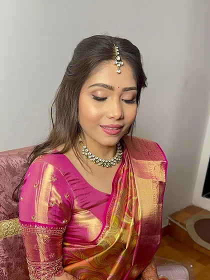 A close-up of the soft eye makeup and radiant skin, perfect for this traditional yet modern look.