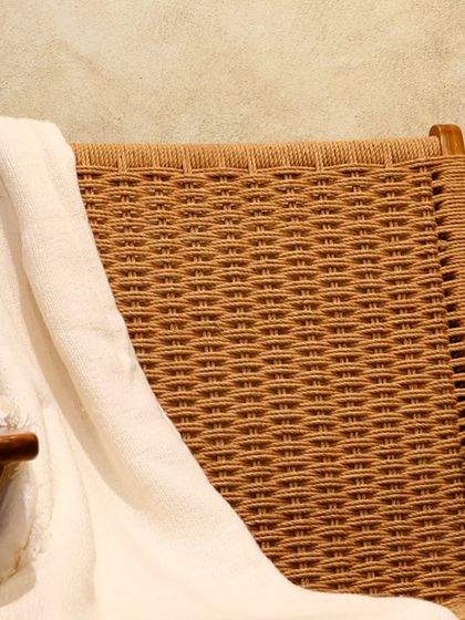 A close-up of the intricate rope weaving on the back of my 'Hatsun' easy chair. This detail provides both aesthetic appeal and durable, flexible support.