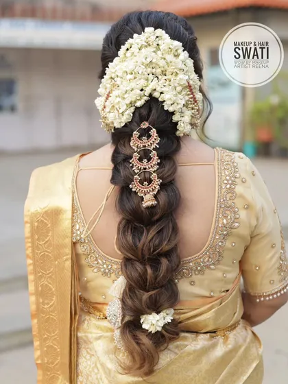 A stunning traditional South Indian bridal braid by my artist Swati. The braid is adorned with fresh jasmine flowers and beautiful temple-style hair jewels.