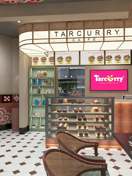 This is a render for Tarcurry Cafe, a space designed to celebrate Odisha's rich culture. We incorporated traditional art forms like "jhoti" and local materials to create a cafe interior that feels authentic, warm, and inviting for every guest.