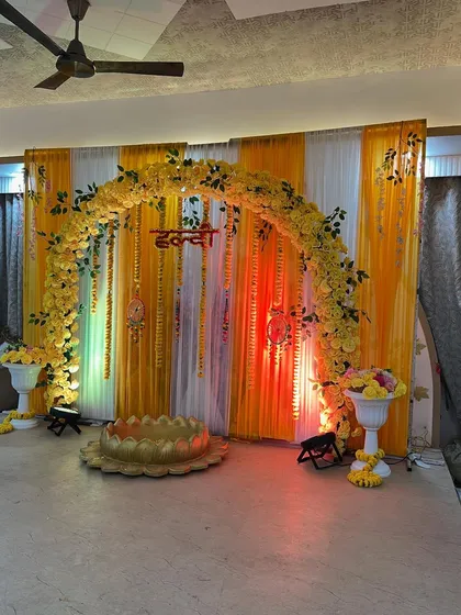 The stage lit with spotlights, highlighting the vibrant yellow color.