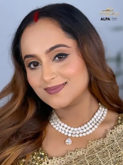 A final portrait of this elegant look, showcasing the timeless beauty of the client.