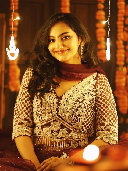 A portrait from the Diwali shoot, showcasing a classic festive makeup look with defined eyes and a radiant complexion.