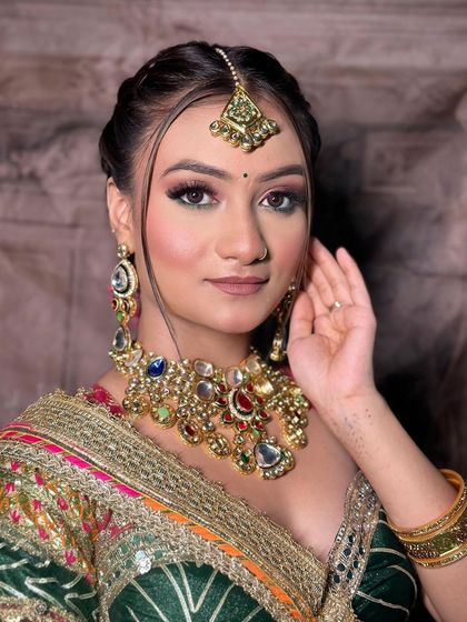 A makeup artist's work on a model wearing our multi-color Navratri lehenga. The close-ups on the makeup are perfect for an MUA's social media.