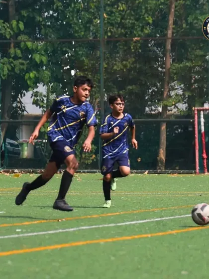 Two of our players in sync during an attacking play at The Winter Cup. This highlights the emphasis we place on teamwork and understanding each other's movements on the field.
