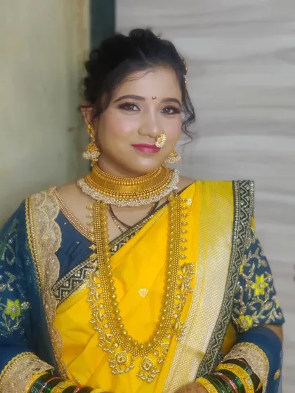 A portrait of Urmila showcasing her soft and radiant bridal makeup.