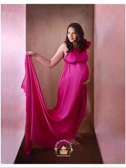 Fabric tosses are so much fun and create such beautiful, dynamic images. This vibrant pink fabric looks stunning against the soft, painted backdrop.