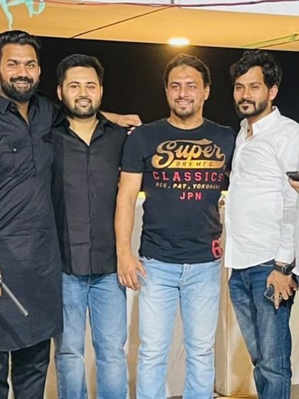 Posing for a group photo with friends at an evening program. My circle of friends and colleagues is a great source of support.