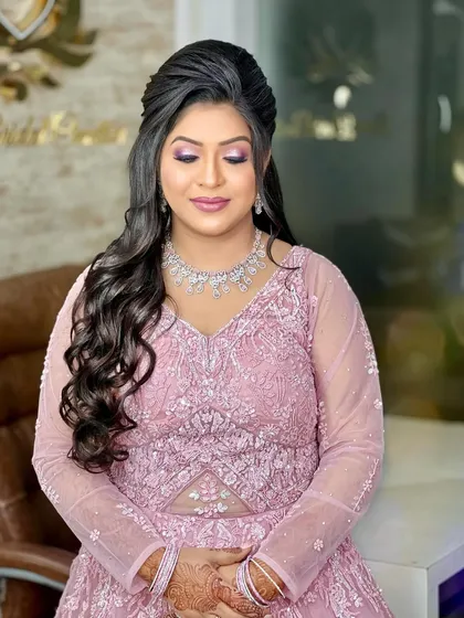 A full view of the bride-to-be, looking serene and happy. The diamond jewellery is the perfect accessory for her embellished gown.