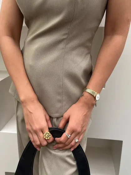 Even a simple monochrome outfit can feel powerful with the right details. A structured bag, a classic watch, and a statement ring add polish and intention to this boss girl look. It's all about those finishing touches.