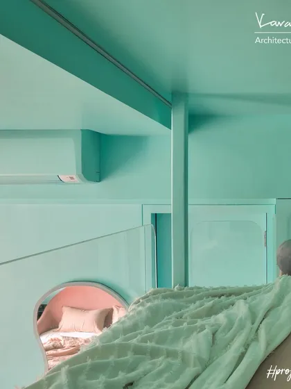 A view from the loft bed in Project 704, looking down into the cozy bed nook below. The design creates a fun, multi-level experience for kids, with separate spaces for sleeping and playing.