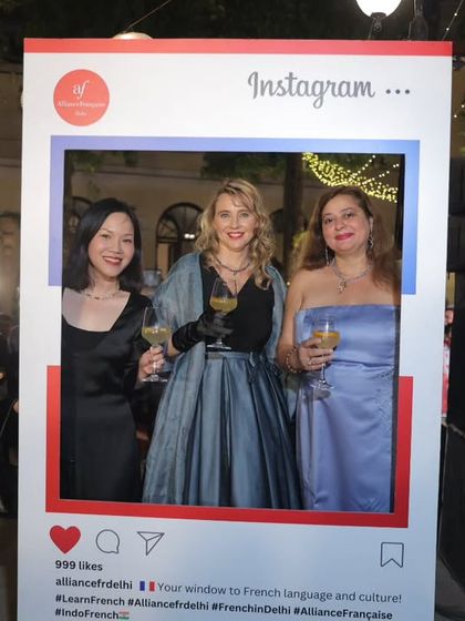 Guests pose with our Instagram frame at the Grand Ball. The event was a glamorous affair, bringing together diplomats, educators, and friends to support a charitable cause.