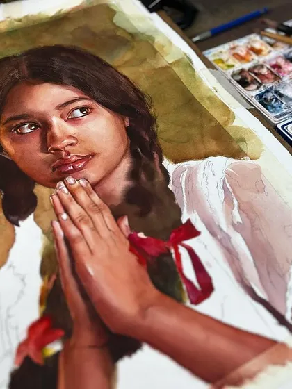 A work-in-progress shot of the young girl's portrait, showing the painting on the easel next to my palette.