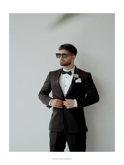 A stylish portrait of the groom, looking sharp and confident on his wedding day.