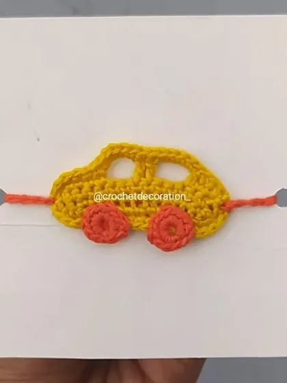 A yellow car wristband, perfect for little vehicle enthusiasts. Like all our wristbands, it's handmade with soft, child-friendly yarn.