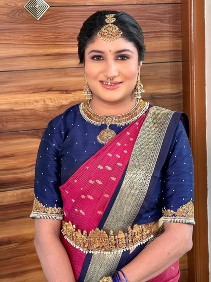 A smiling portrait that radiates timeless beauty and cultural grace.