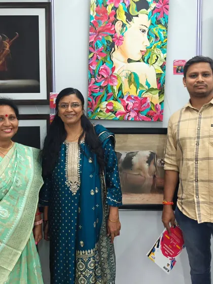 Posing with visitors in front of my painting 'Wild and Beautiful' at the exhibition.