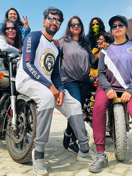 A fun, casual group photo with our bikes. We are more than a club; we are a family of riders.