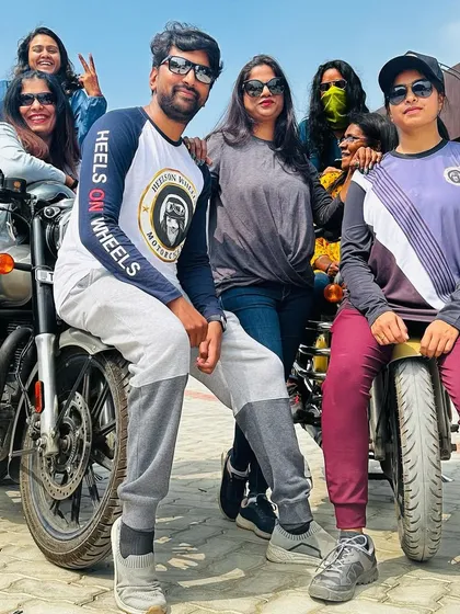 A fun, casual group photo with our bikes. We are more than a club; we are a family of riders.