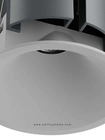 This image displays our recessed downlight with a clean, white reflector and trim. It is designed to blend seamlessly into white ceilings, offering a soft, diffused light that is perfect for general ambient illumination in any modern space.
