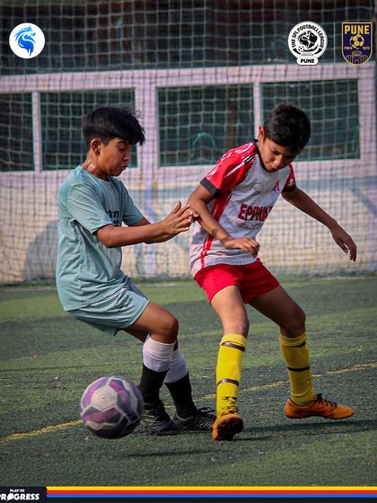Two players locked in a physical battle for the ball. This is the kind of determination we see every week in Pune.